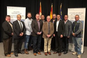 Representatives of the companies receiving funding with New Brunswick Deputy Premier Robert Gauvin